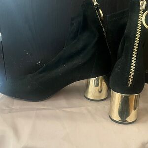 Barely worn, black ankle boots with reflective hold heel